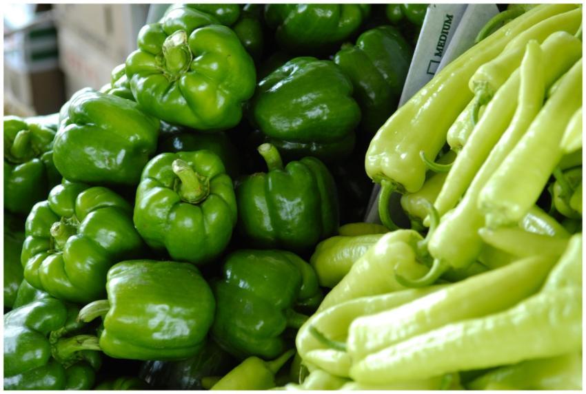 Close-up of fresh green bell peppers and chili pep