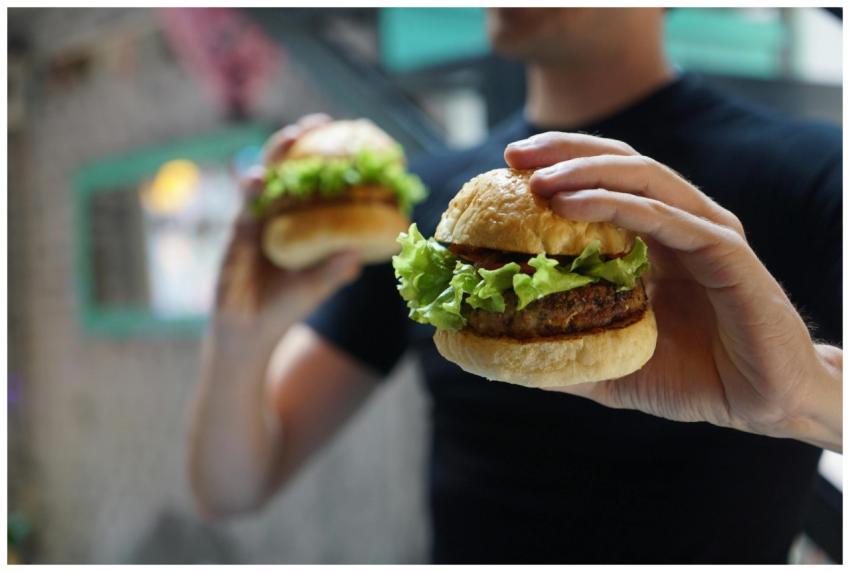 A close-up shot of a person holding a homemade bur