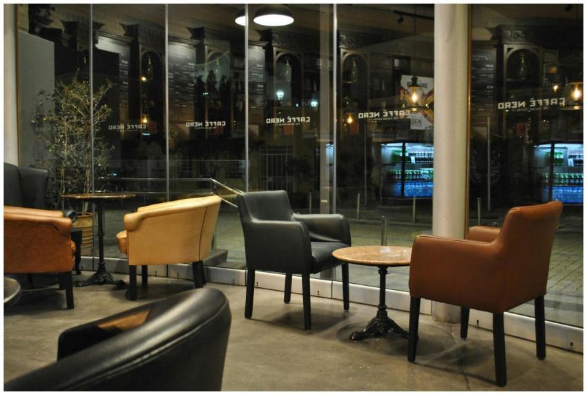 Quiet and cozy seating area in a modern cafe durin
