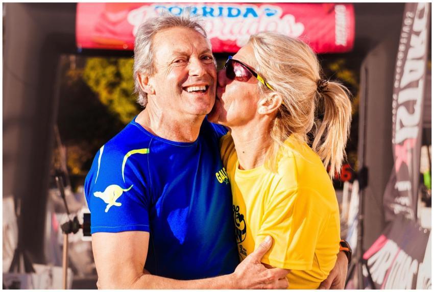 Happy senior couple embracing and laughing outdoor