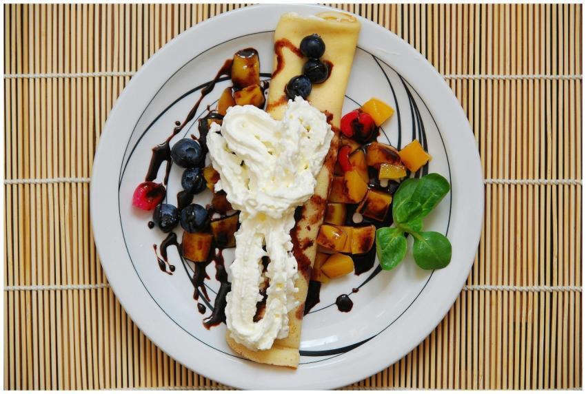 A mouthwatering pancake topped with fresh fruits a