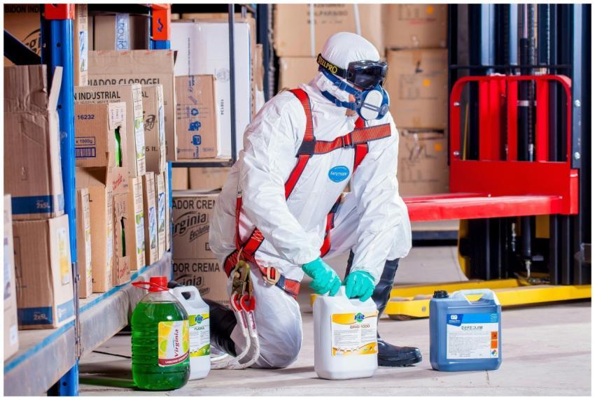 Industrial worker in protective gear handling chem
