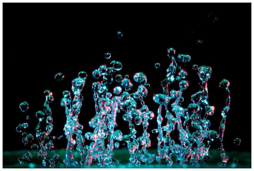 A striking close-up of vibrant water droplets capt