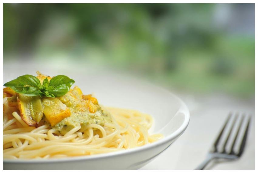 Close-up of freshly made spaghetti topped with bas