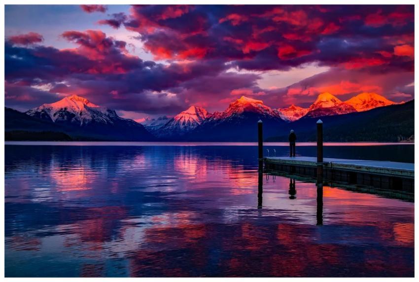 Stunning sunset over a serene lake with colorful s
