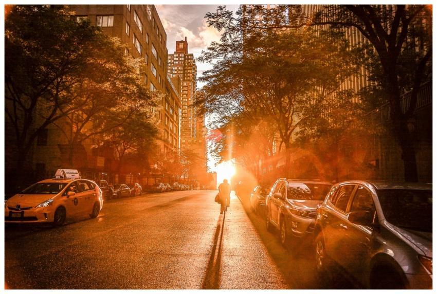 Silhouette of a cyclist during sunset on a New Yor