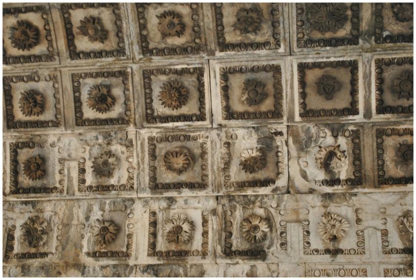 Close-up of an ancient Roman ceiling featuring det