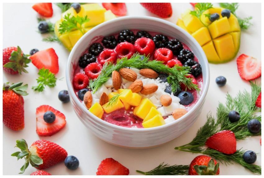 Colorful smoothie bowl with fresh fruits and almon