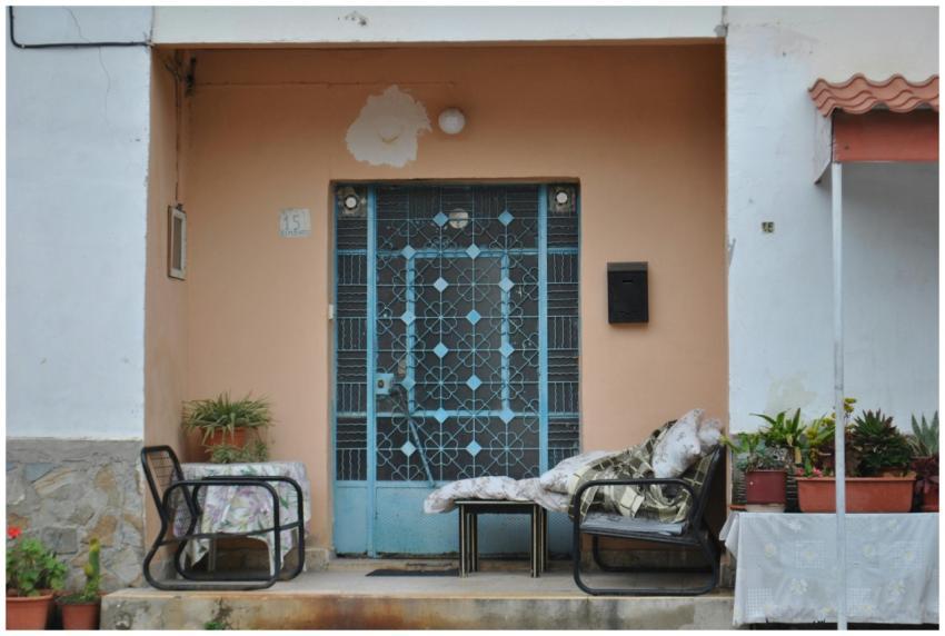 Cozy porch with chairs and plants at a Mediterrane