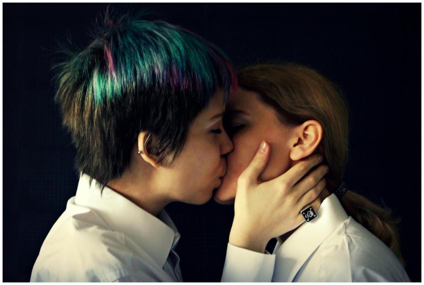 Close-up shot of two women sharing an intimate kis