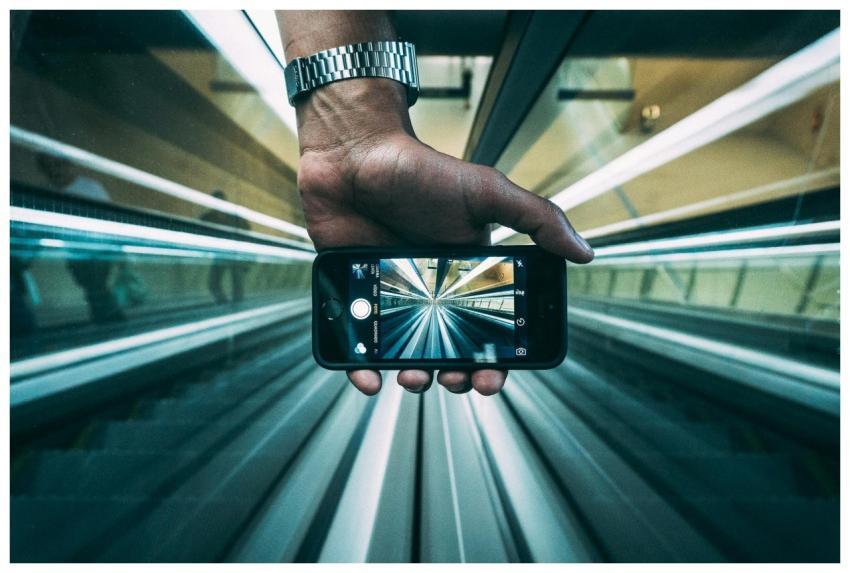 Creative shot showing an escalator view through a
