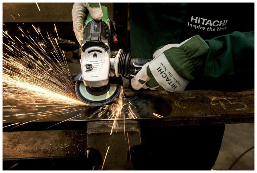 Close-up of a skilled worker using a grinder with