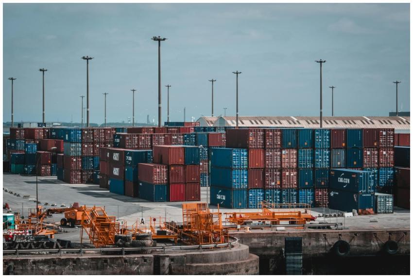 Colorful cargo containers stacked at a busy indust