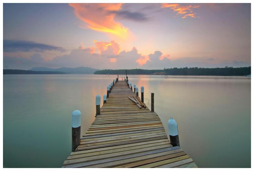 Tranquil view of a wooden pier extending into the