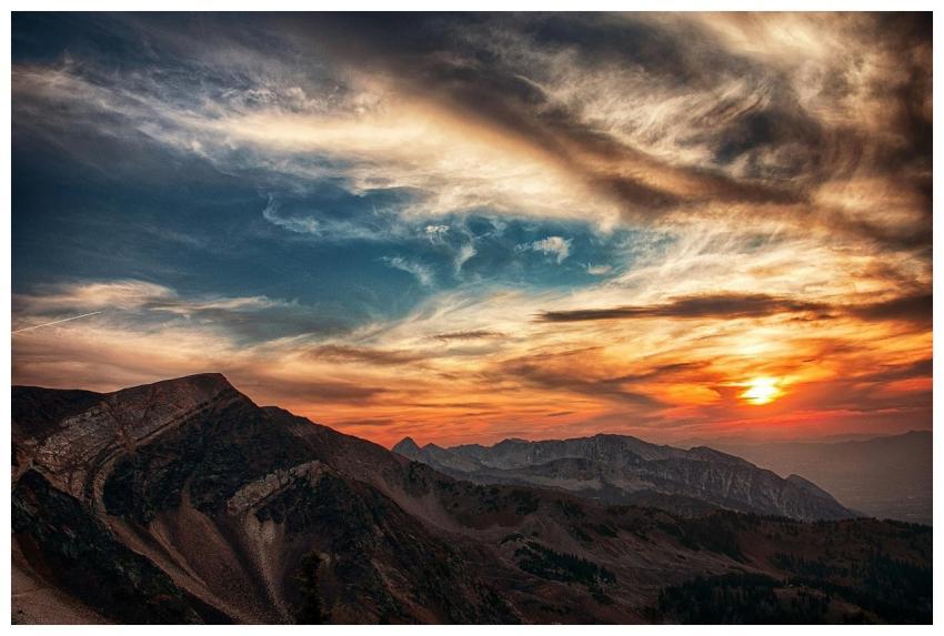 Stunning sunset over rugged mountains with dramati