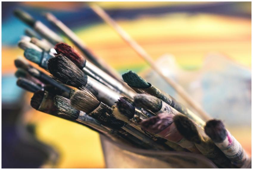 Close-up of colorful paintbrushes in a creative an