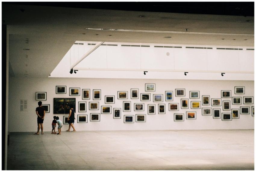 A family exploring an art exhibition in a modern g