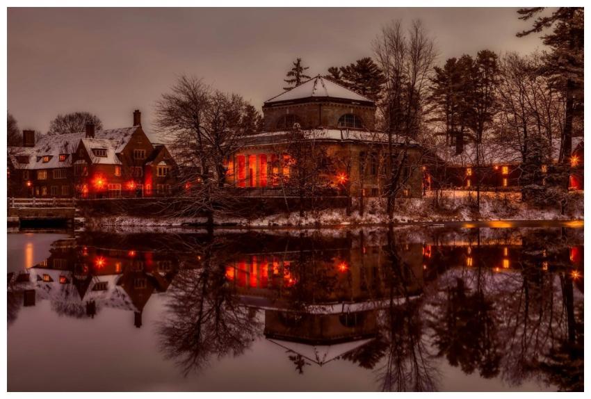 Tranquil winter scene with illuminated architectur