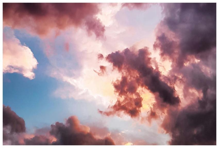 A vibrant and dreamy sky with pink and orange clou