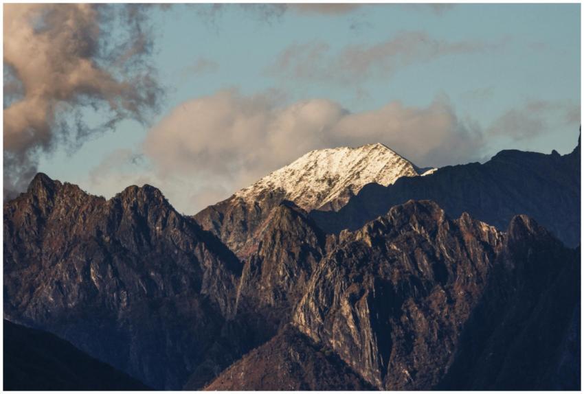 A stunning view of a snow-capped mountain peak sur
