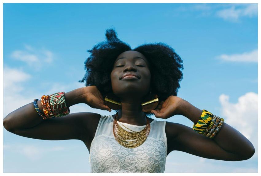 Portrait of a joyful African woman with afro hair,