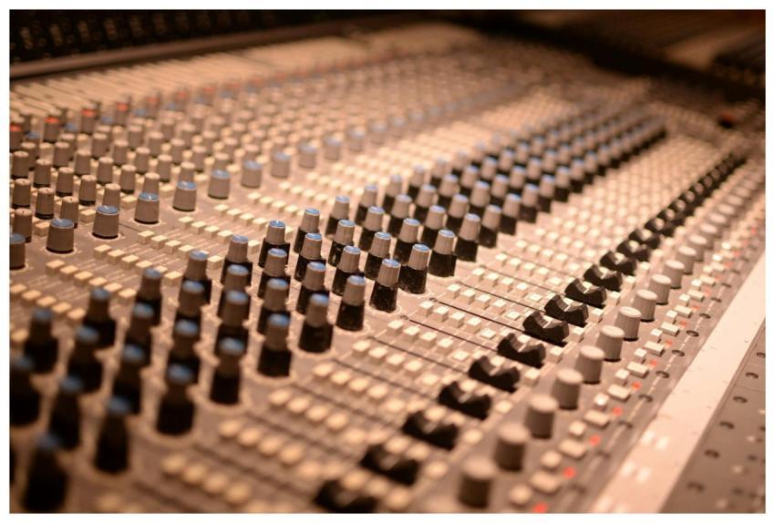 Detailed view of an analog audio mixing console wi