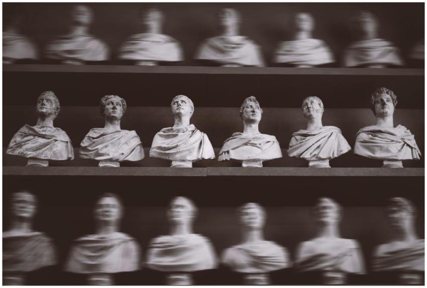 Black and white photo of Roman busts on display in