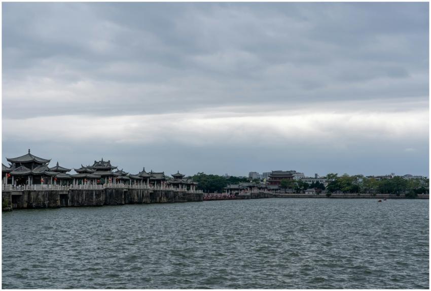 Scenic view of ancient bridge under cloudy skies o