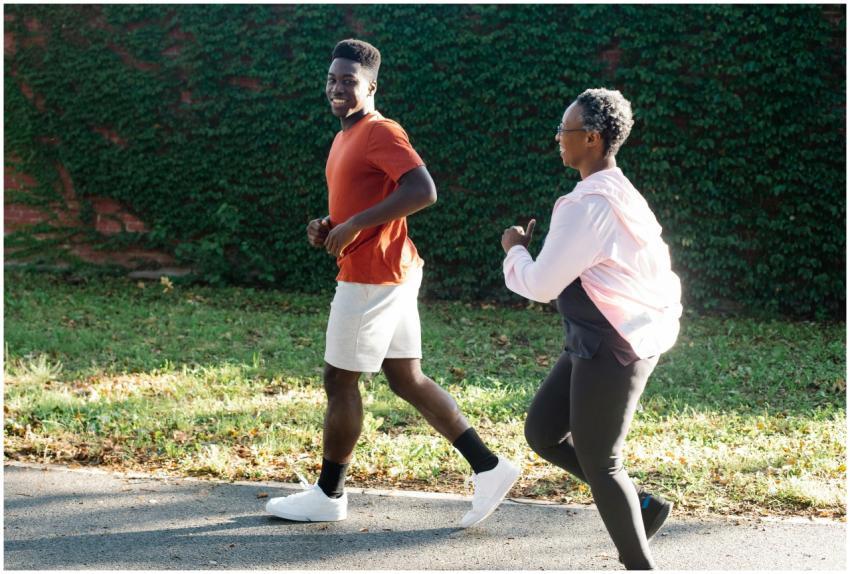 African American couple jogging outdoors on a sunn