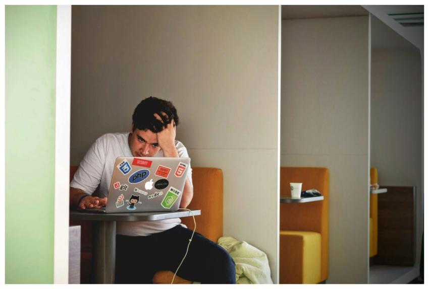 Man showing stress and frustration while working r