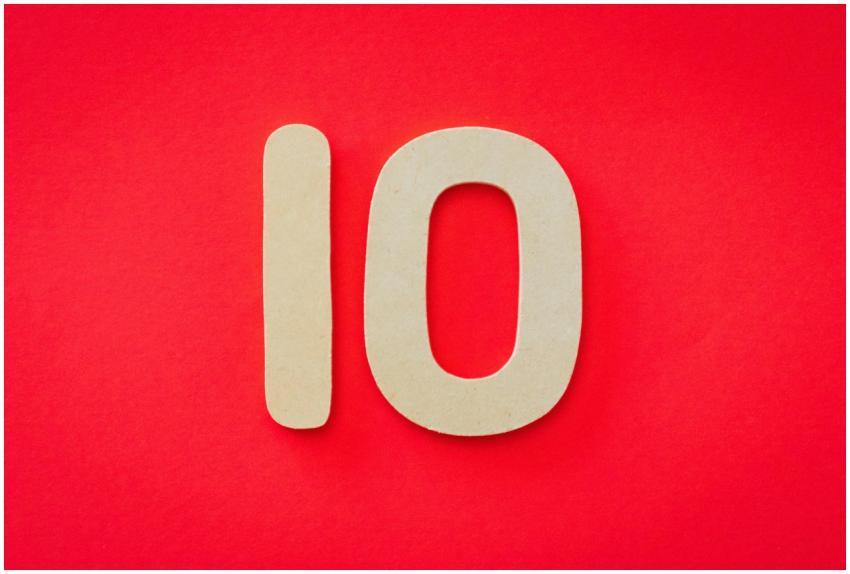 Wooden number 10 on a vibrant red background, idea