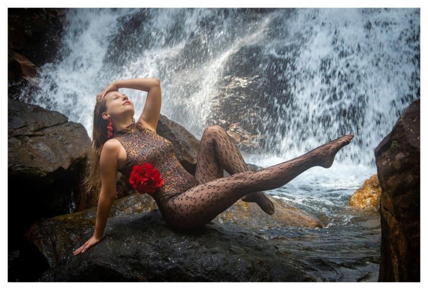 Woman Waterfall Pose Stones