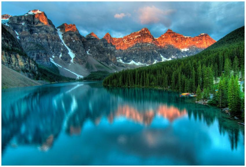 Capture the serene beauty of Moraine Lake with sun
