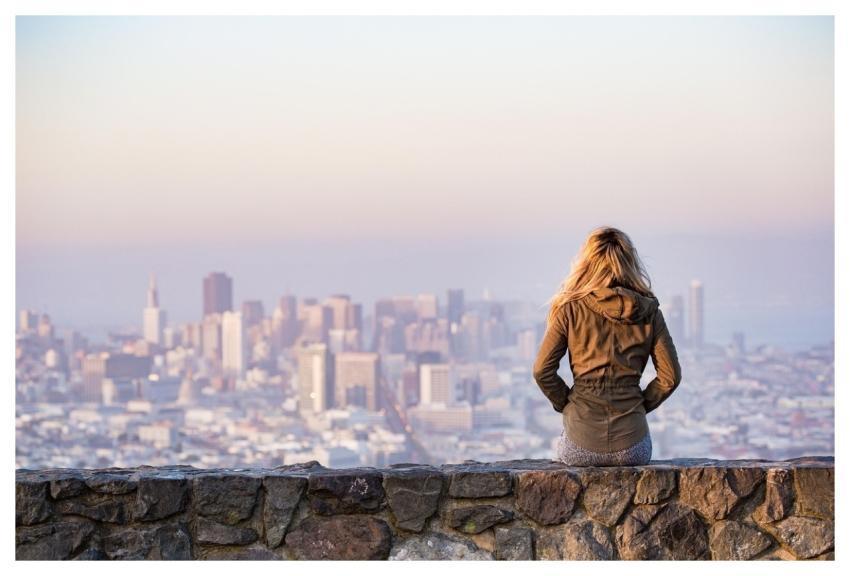 Blonde Sitting Wall Buildings