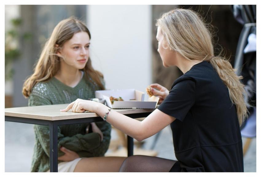 Girls Sitting Terrace Eating
