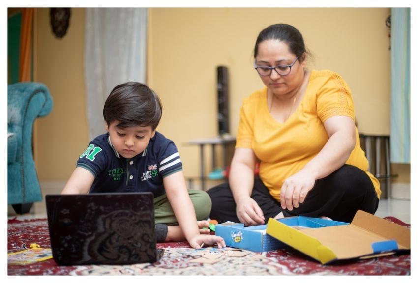 Family Online School Living Room Mother And Son