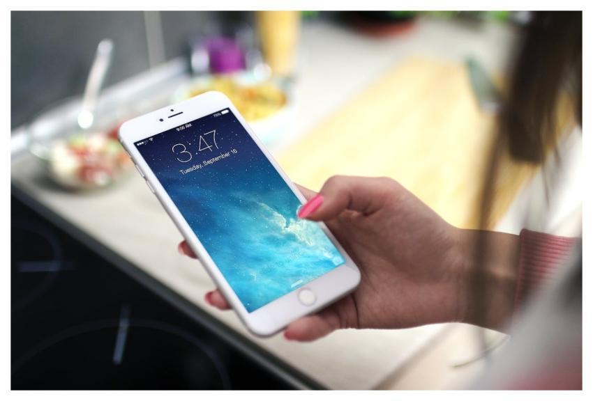 Close-up shot of a person holding a smartphone in