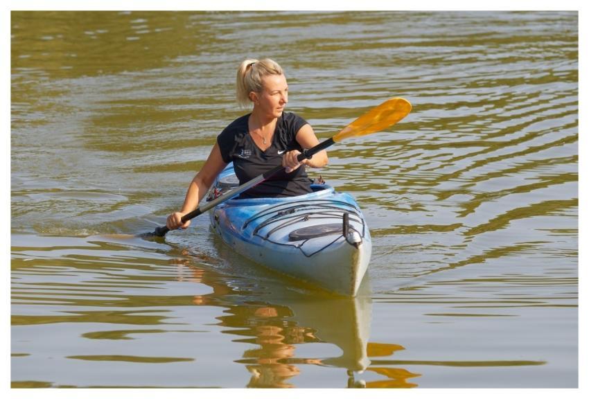 Woman Rowing Kayak Lake