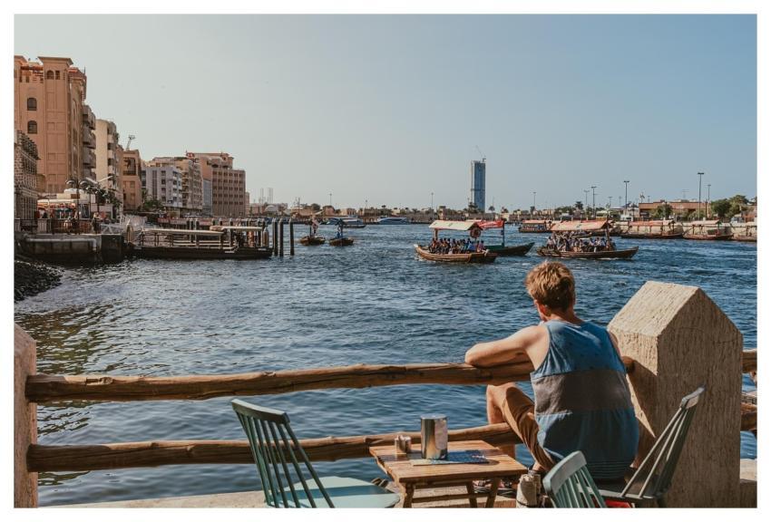 Dubai Creek Waterfront Man Sitting Abra Boats