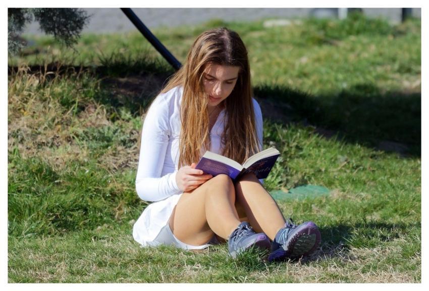 Girl Reading Book Sitting