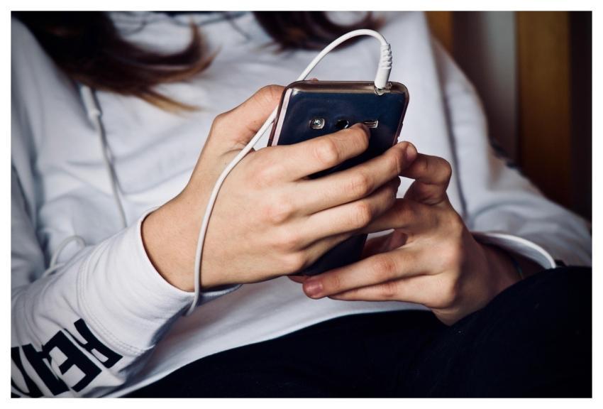 Woman Mobile Phone Listening To Music Listening