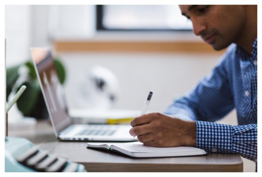 Man Writing Laptop Computer