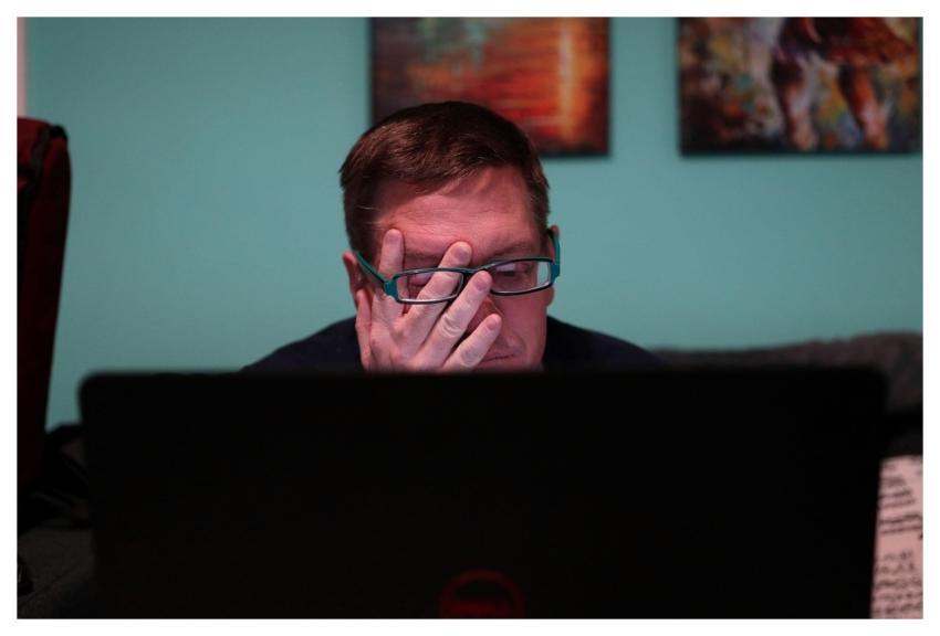 Man Computer Tired Zoom Meeting