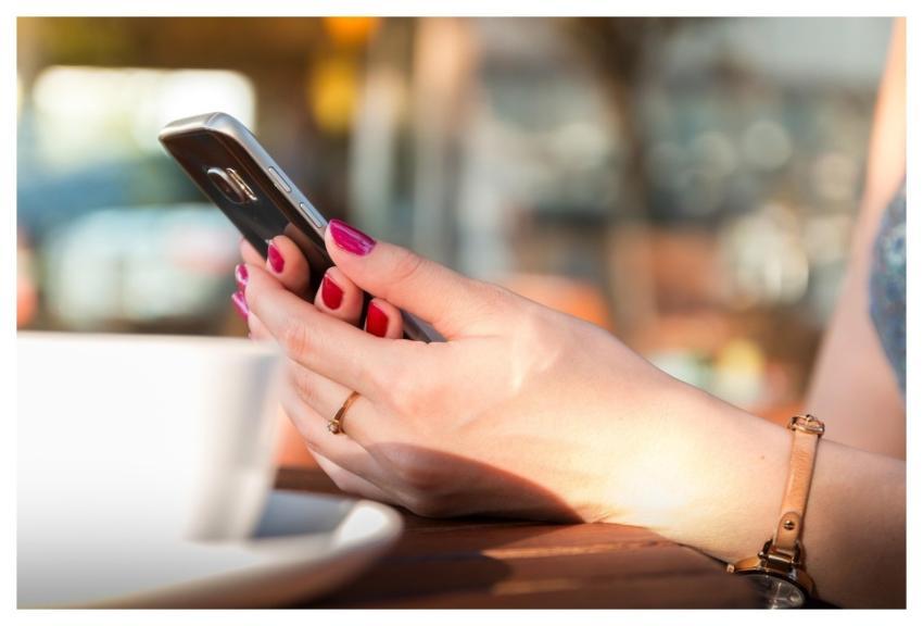 Hands Holding Smartphone Chatting