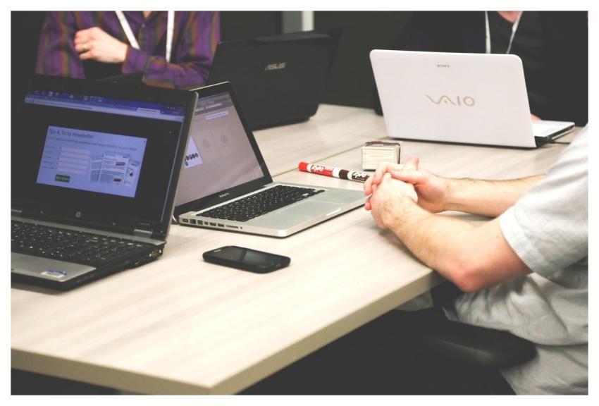 Laptops Meeting Businessmen Coworkers