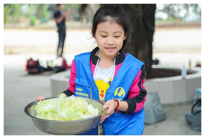 Girl Chinese Washing Vegetables Camping
