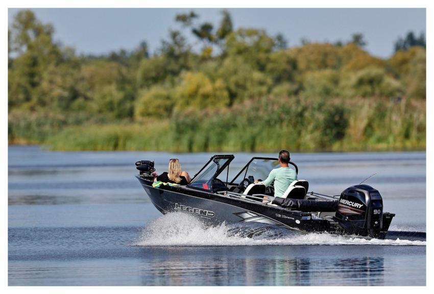 Man Woman Motorboat Splash