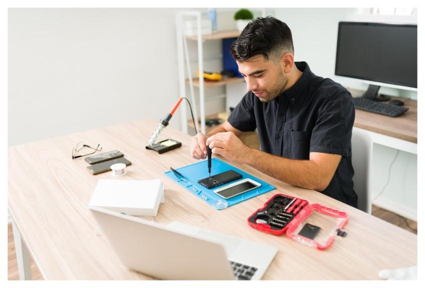 Man Technician Repair Smartphone