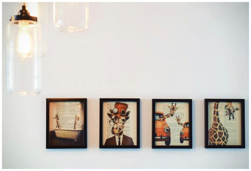 A modern interior display of four framed giraffe-t