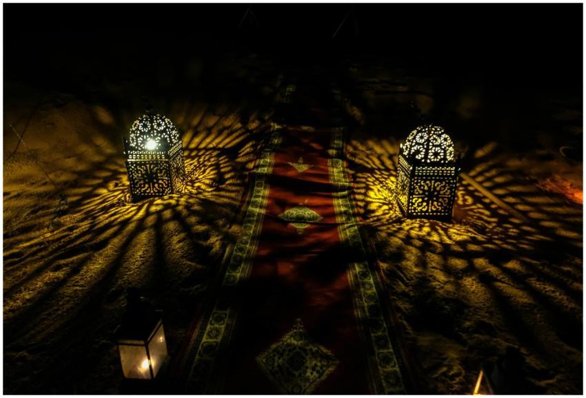 Decorative Moroccan lanterns casting intricate lig